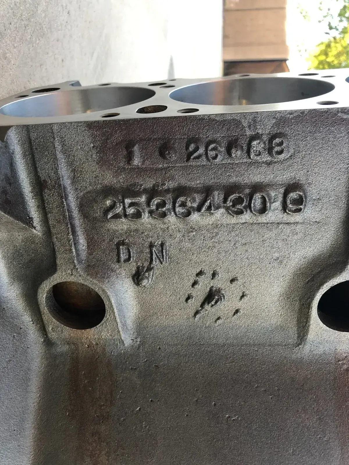Close-up of stamped engine block numbers