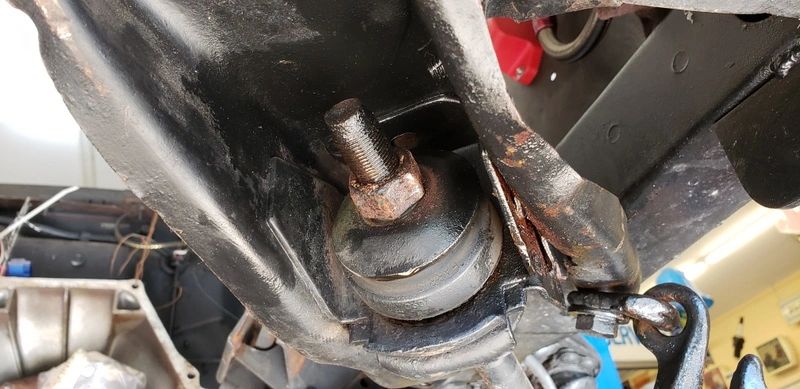 Car suspension system with visible bolt.