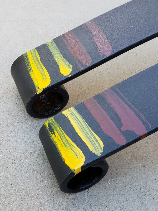 Painted metal bars with colorful streaks.