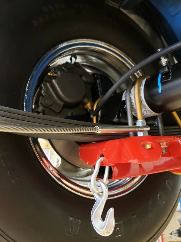 Vehicle wheel with suspension and hook.