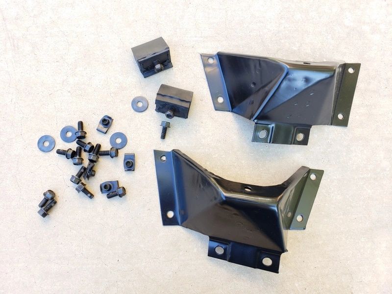 Metal brackets and hardware on beige background.