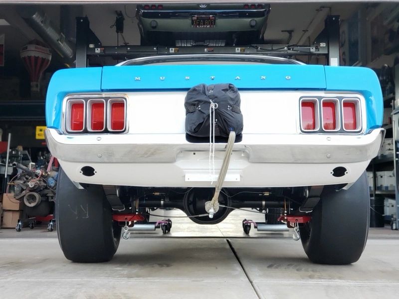 Blue Mustang rear view with drag racing gear.