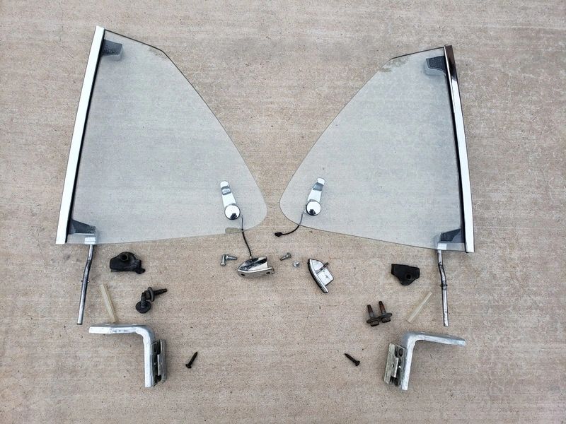 Car window parts arranged on the ground.