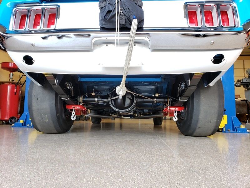 Rear view of a car on lift.