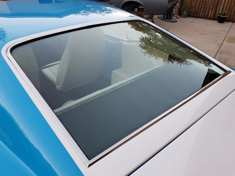 Blue vintage car rear window and interior.