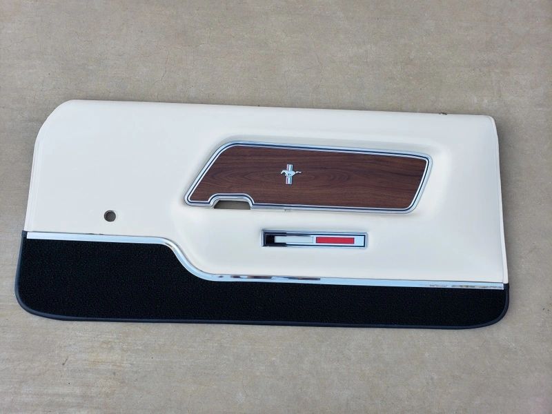 Classic car door panel with emblem.