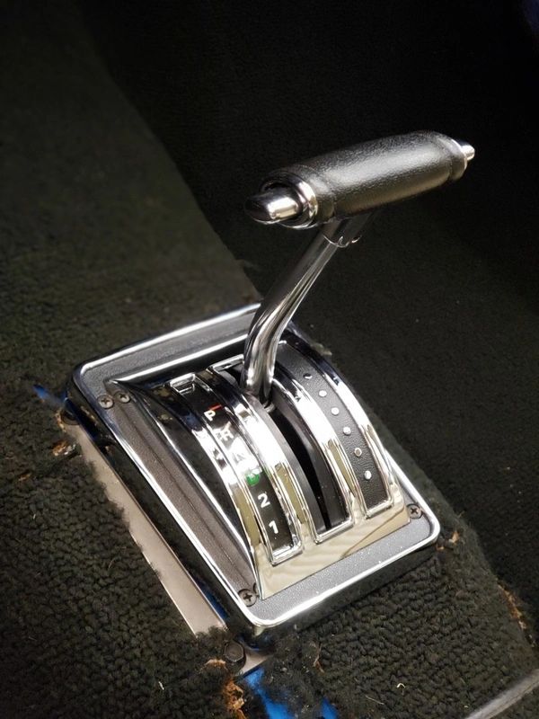 Classic car gear shift with leather handle.