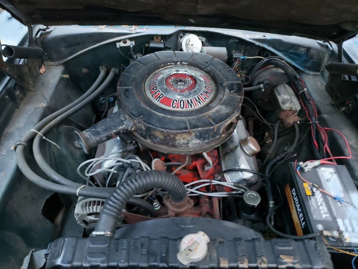 Classic car engine with Super Commando branding.