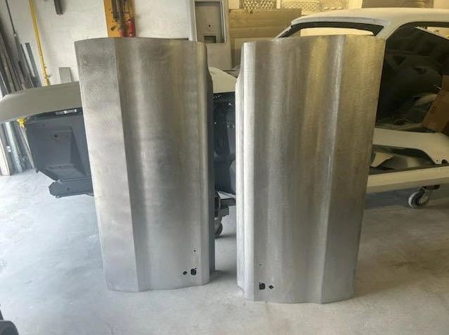 Two metal panels in a workshop.