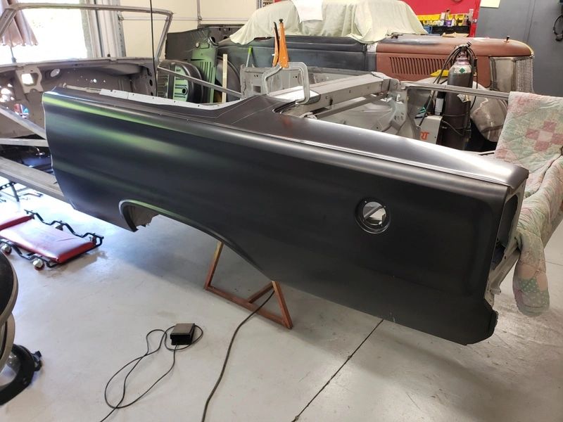 Car body panel in a workshop.