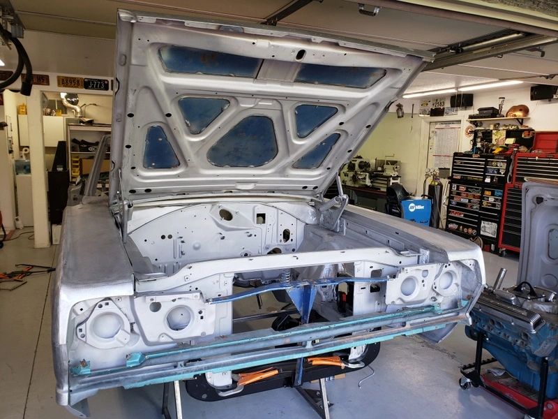 Car body in garage under restoration.
