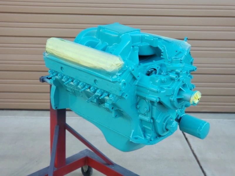 Teal engine on a stand.
