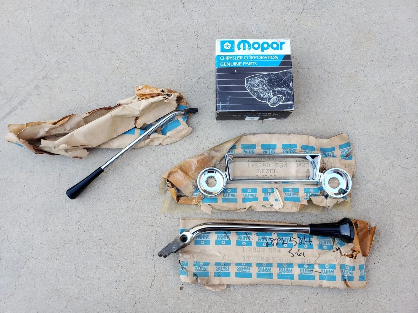 Mopar car parts with packaging materials.