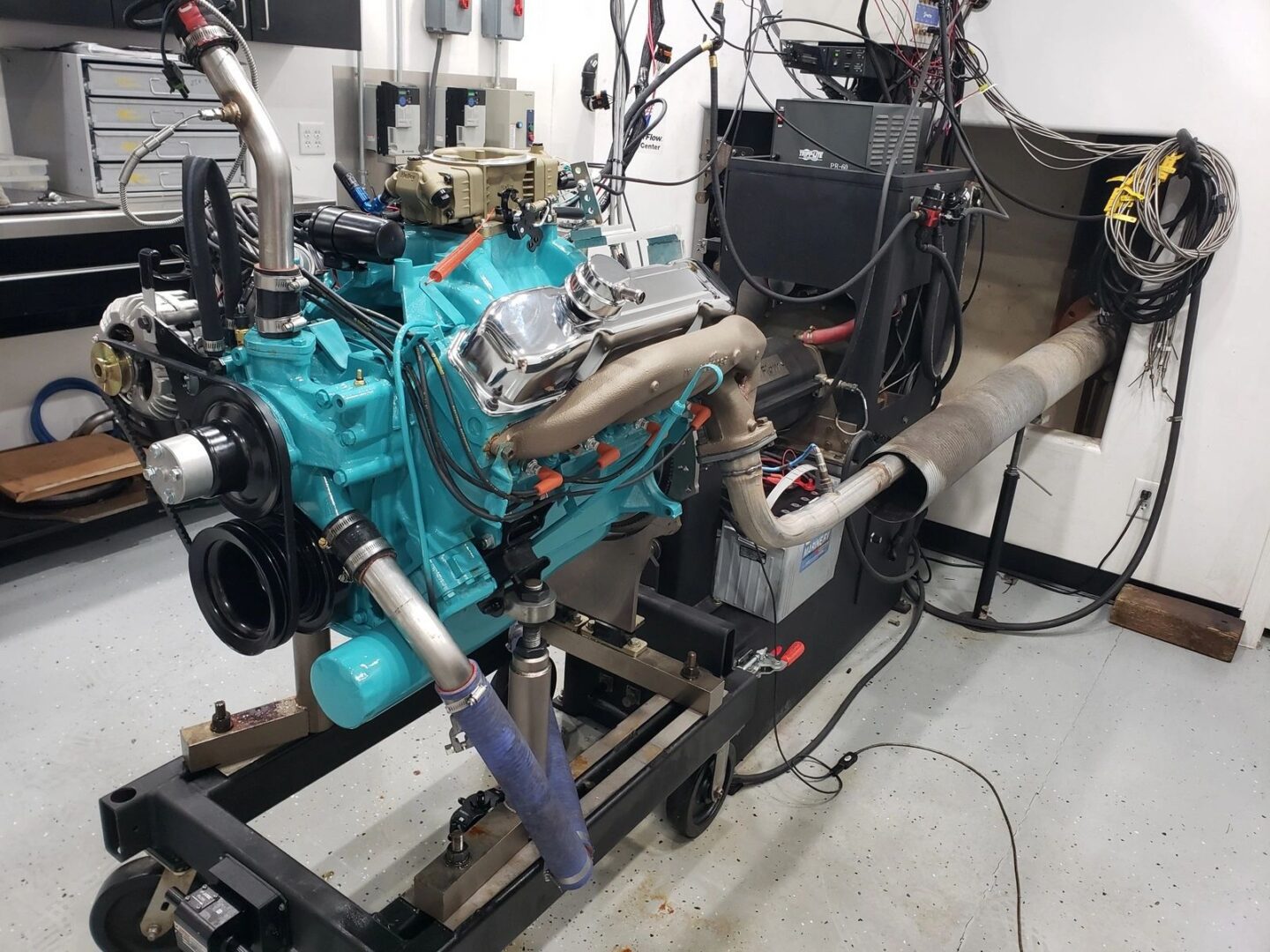 Engine testing setup in a workshop environment.