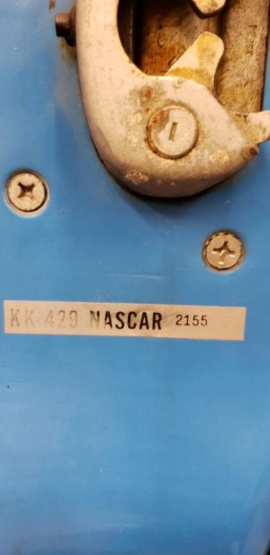 Blue metal panel with NASCAR label.