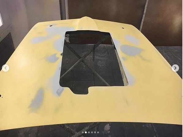 Yellow hood with a central rectangular cutout.