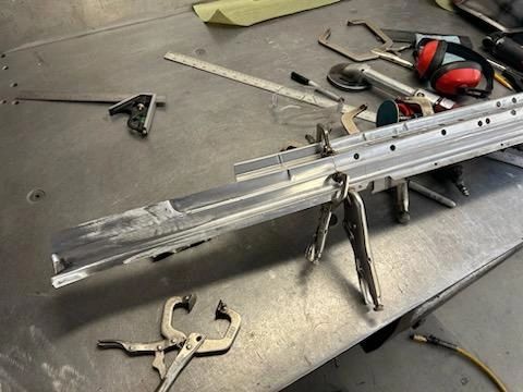 Metalwork table with tools and clamps.