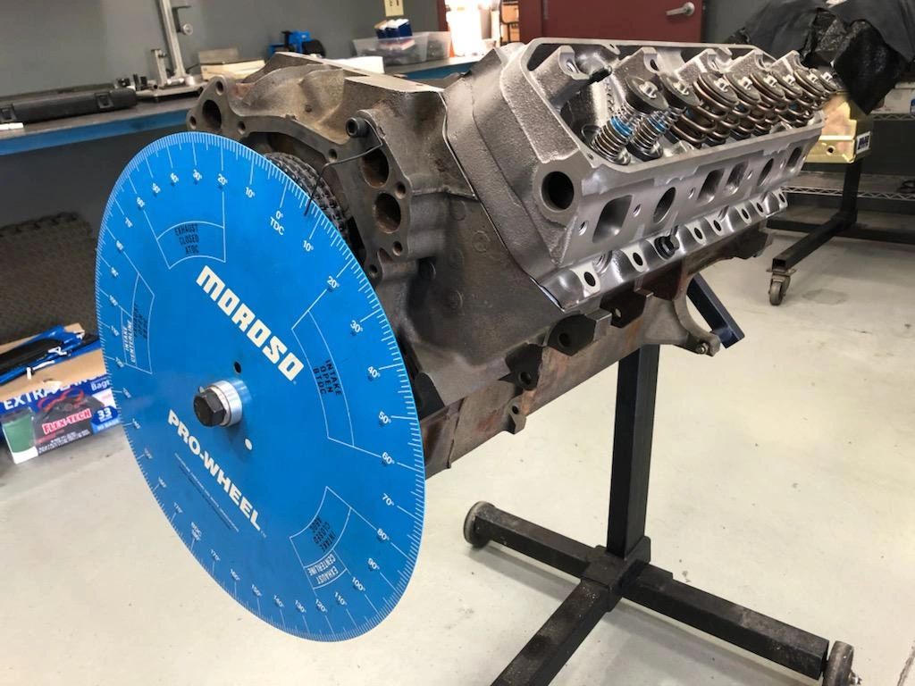 Engine block with blue degree wheel attached.
