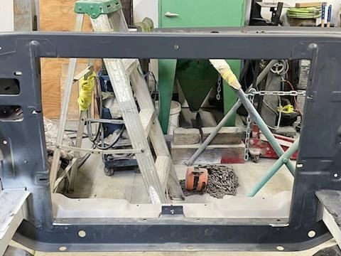 Workshop with ladders and tools in view.