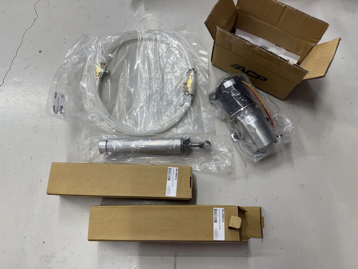 Car parts and cables with packaging boxes.