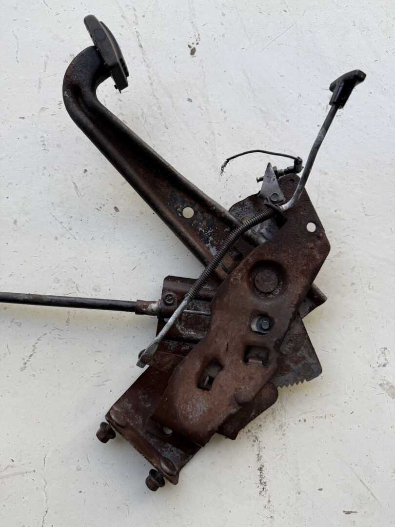 Old rusty mechanical lever on white background.
