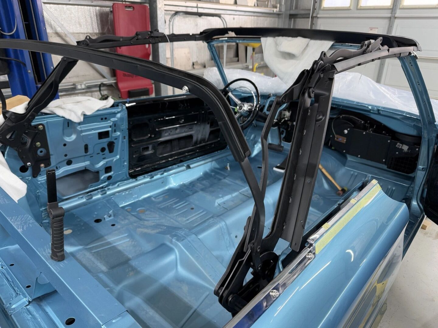Blue convertible car interior under restoration.
