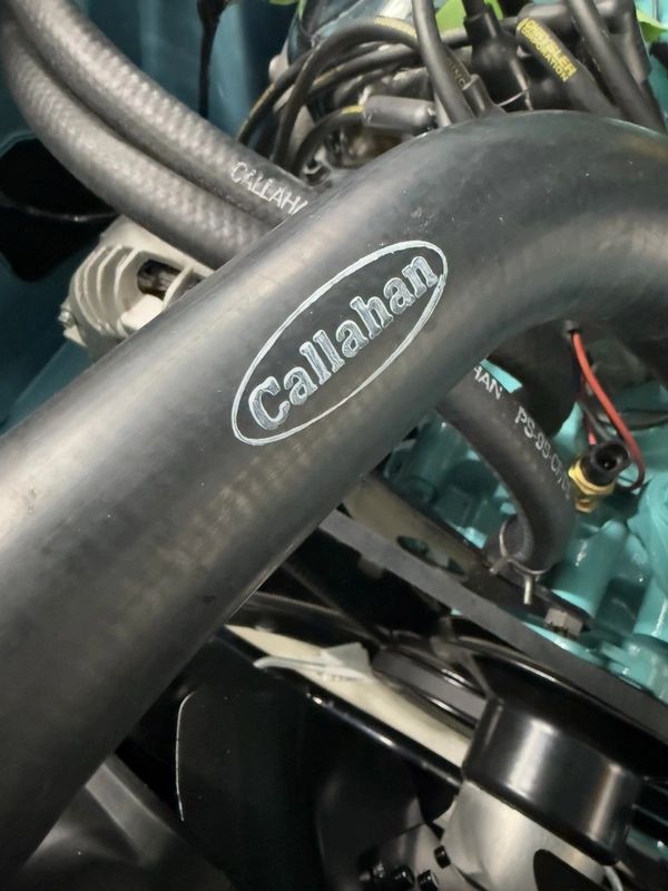 Engine hose labeled "Callahan" close-up view.