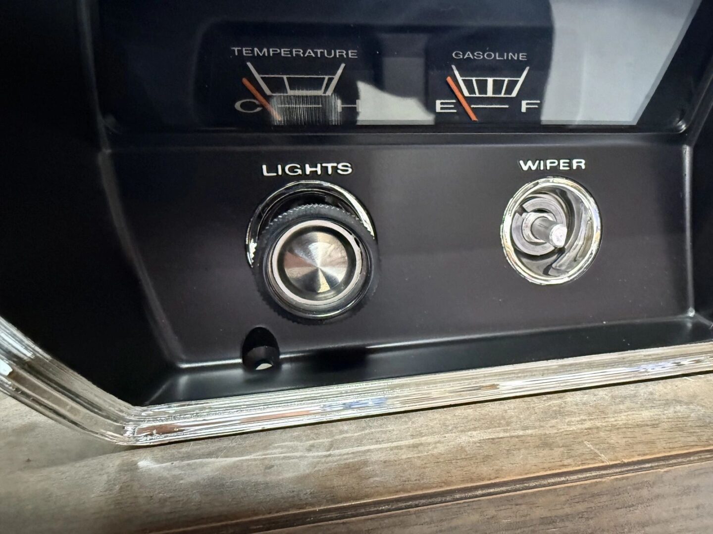 Dashboard controls with temperature and fuel gauges.