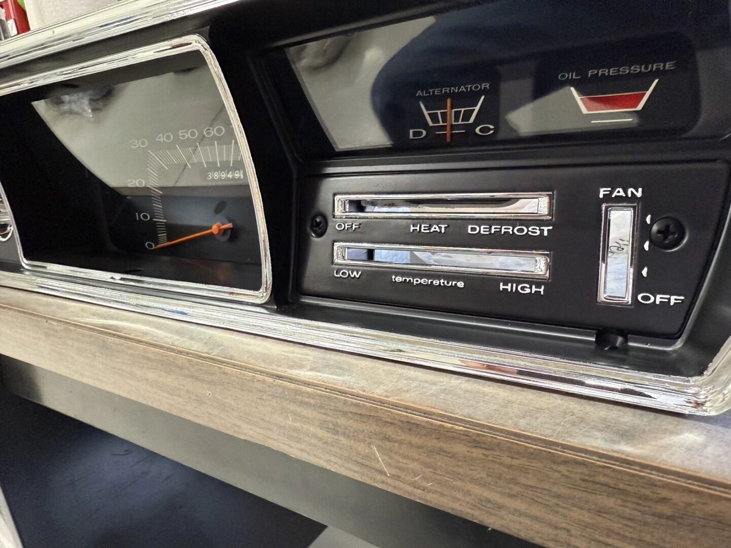 Vintage car dashboard with temperature controls.