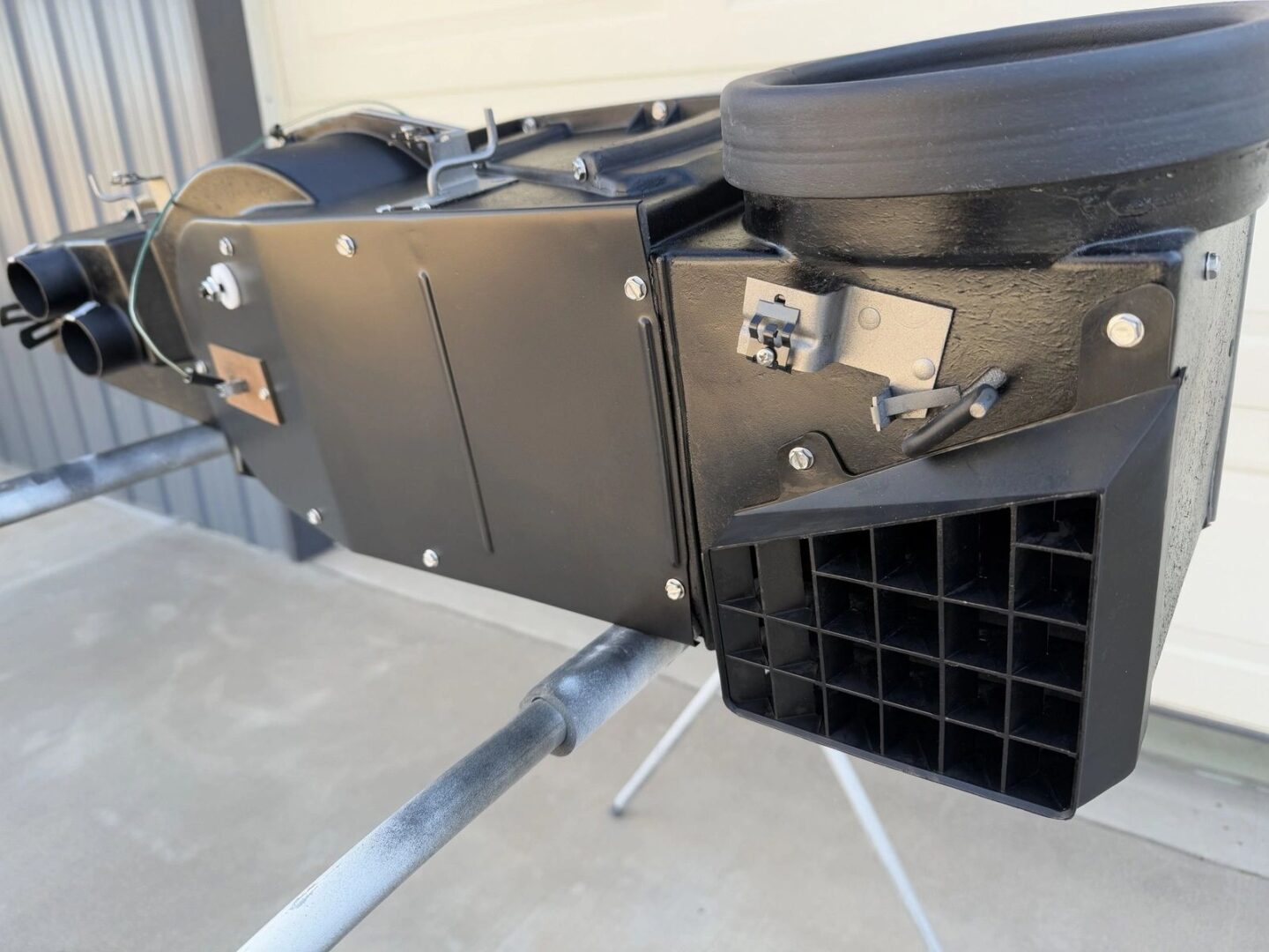 Industrial black machine with grid feature.