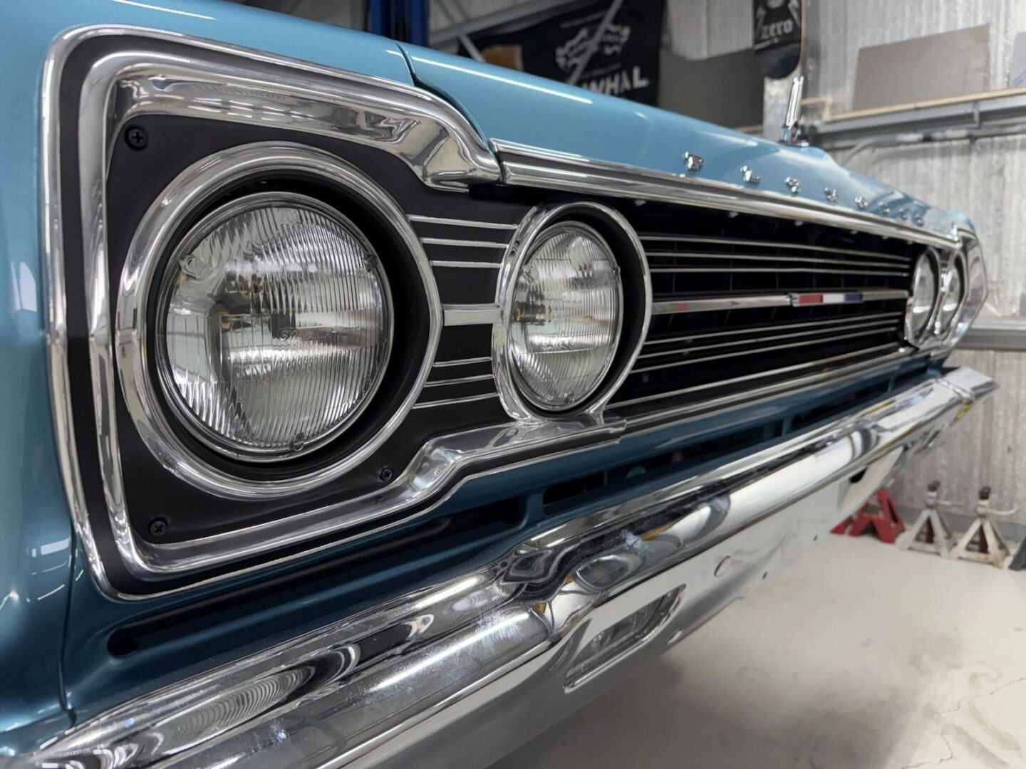Classic blue car with chrome grille.