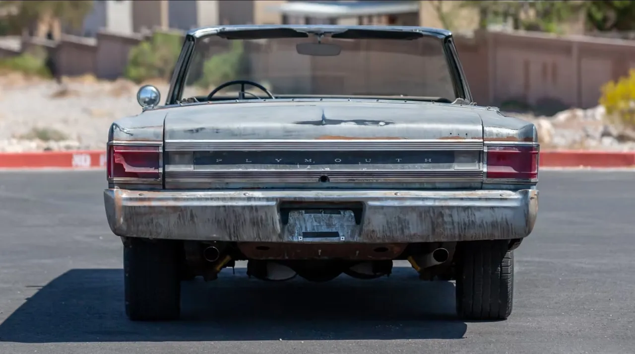 Rear view of a vintage convertible car.