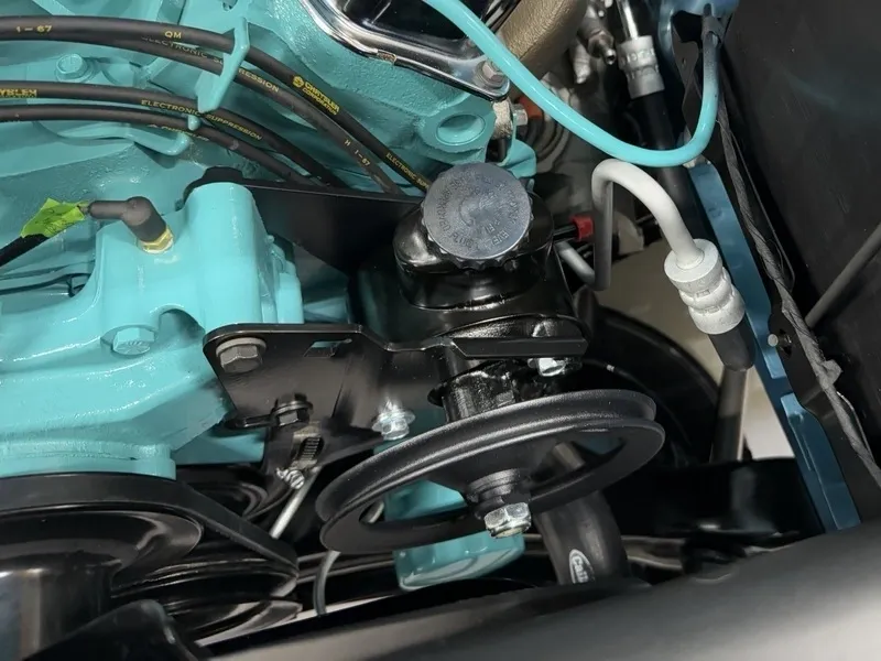 Engine components with blue and black parts.