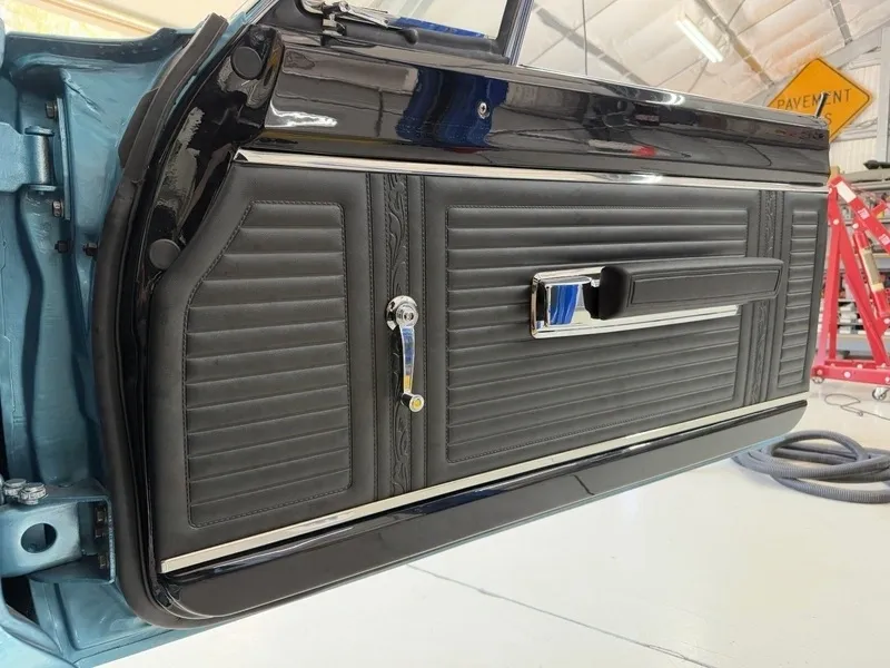 Classic car black interior door panel.