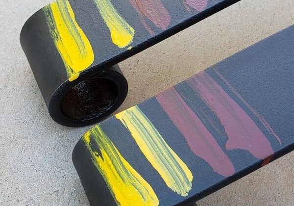 Painted metal bars with colorful streaks.