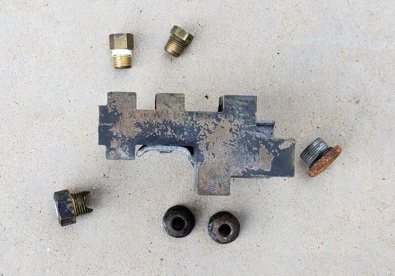 Metal fittings and a rusty tool piece.