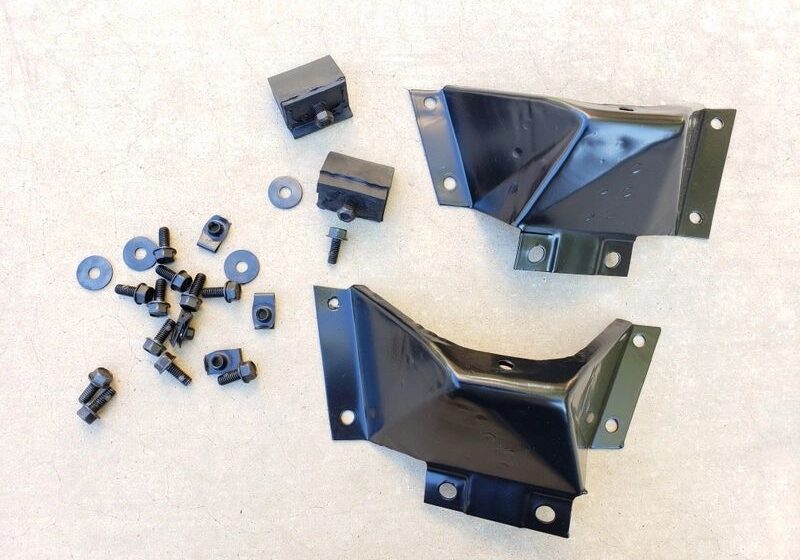 Metal brackets and hardware on beige background.