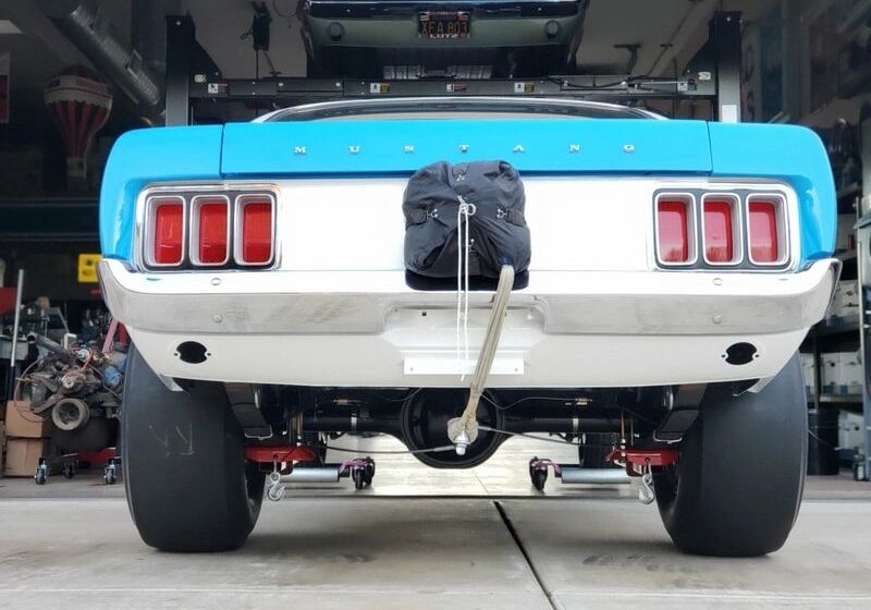 Blue Mustang rear view with drag racing gear.