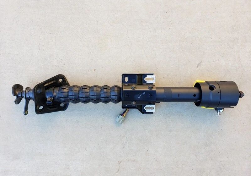 Industrial mechanical component on concrete surface.