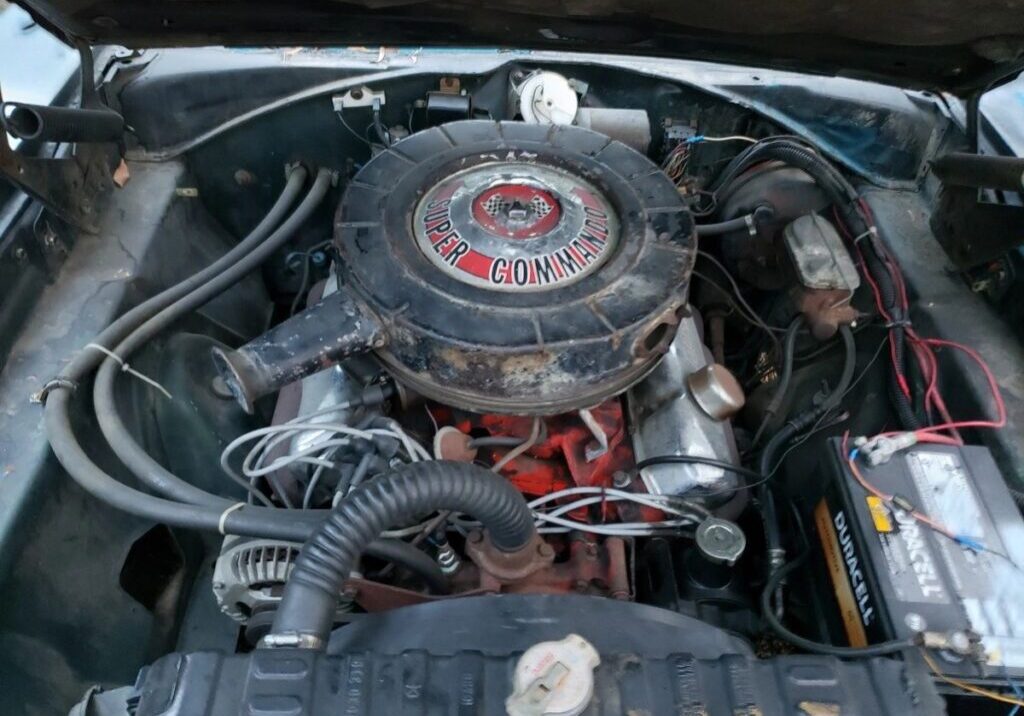 Classic car engine with Super Commando branding.