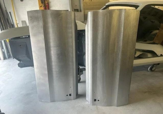 Two metal panels in a workshop.