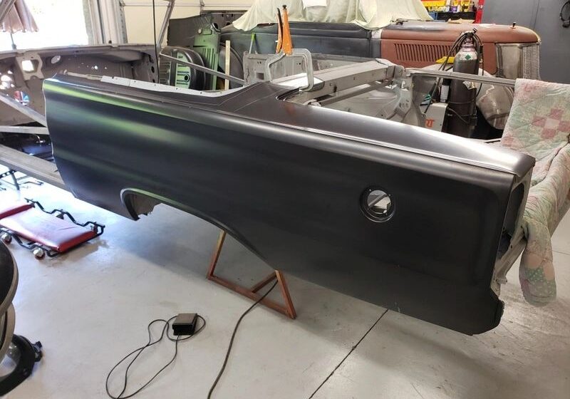 Car body panel in a workshop.