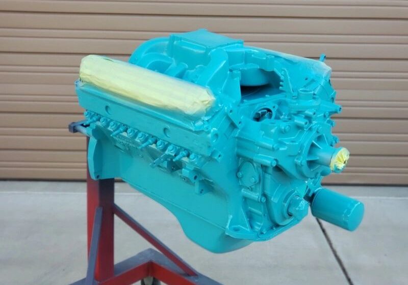 Teal engine on a stand.