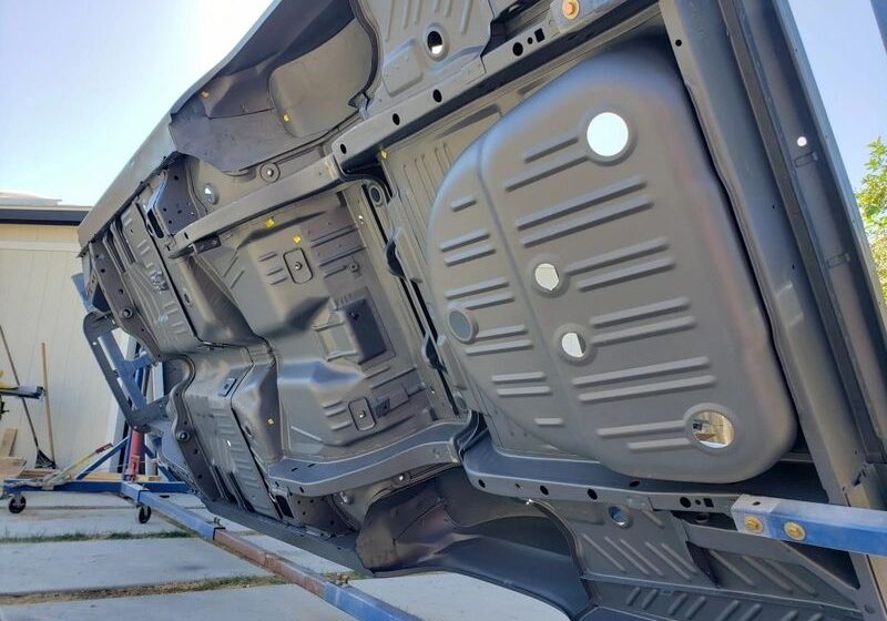 Underside of a vehicle on rotisserie.