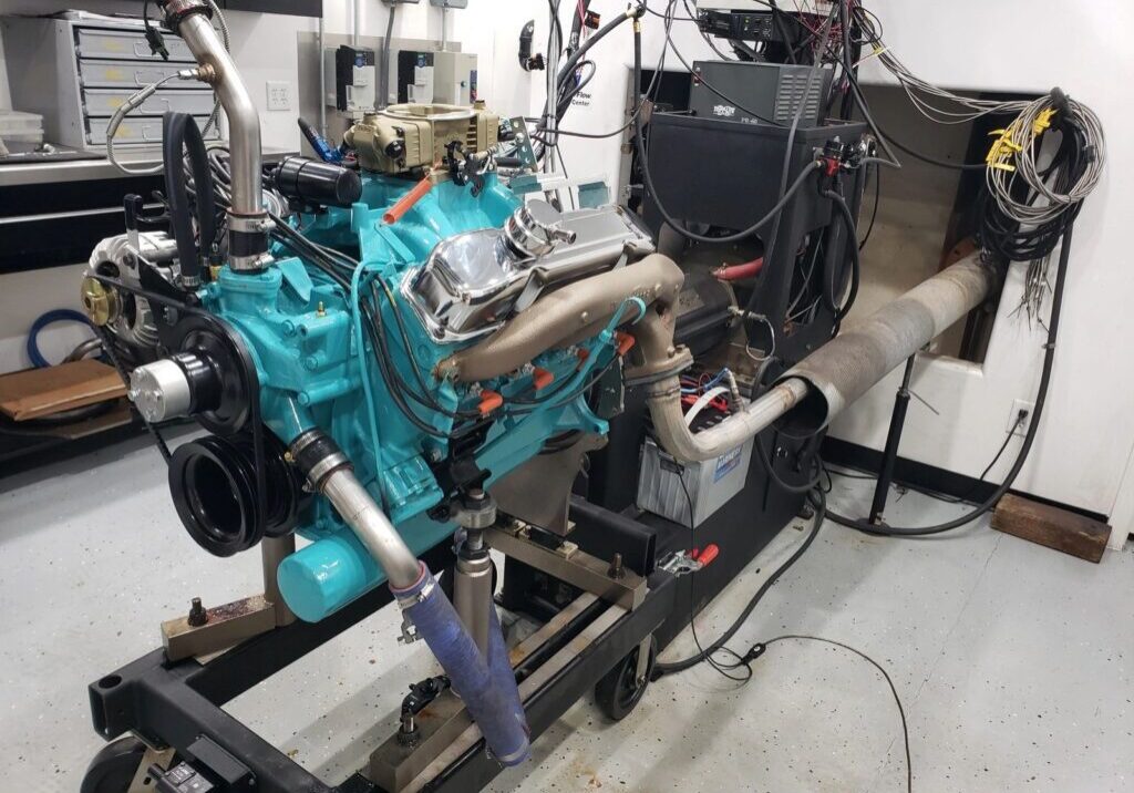 Engine testing setup in a workshop environment.