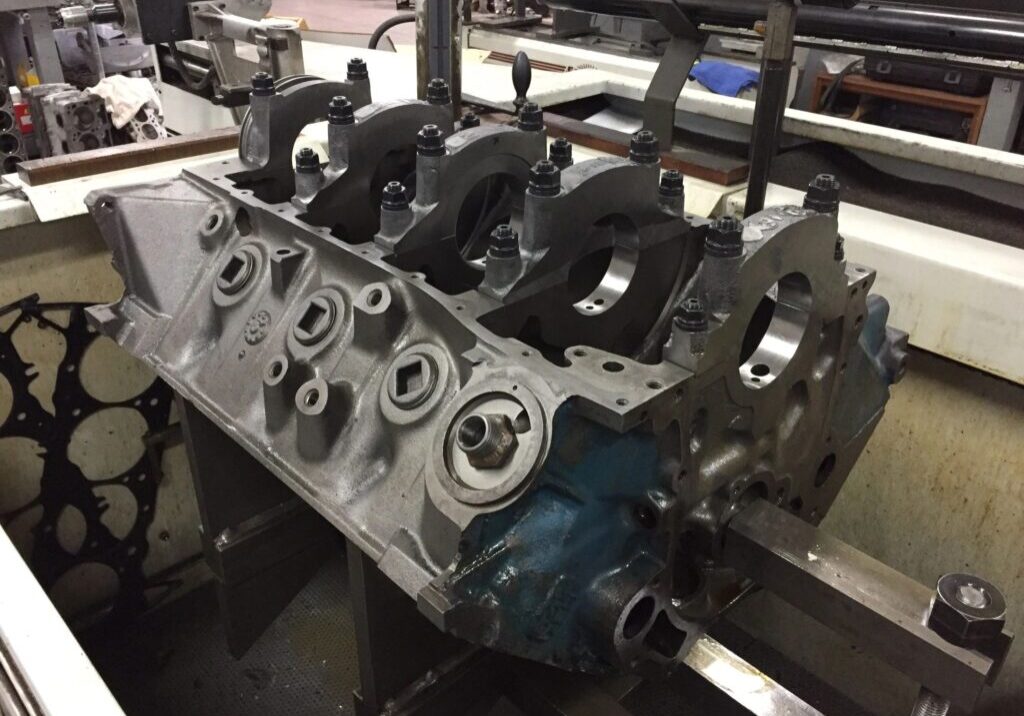Engine block on a workshop table.