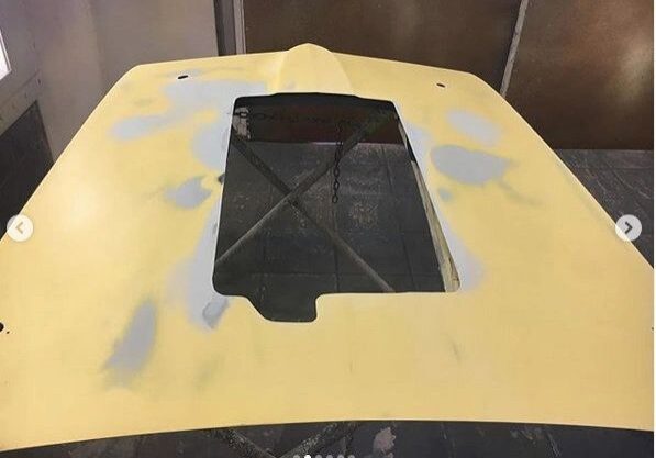 Yellow hood with a central rectangular cutout.