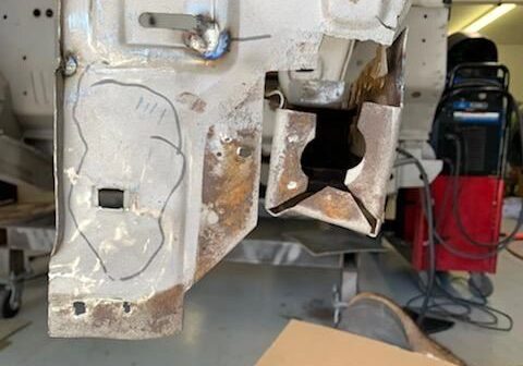 Metal structure with cut-out and drawing.