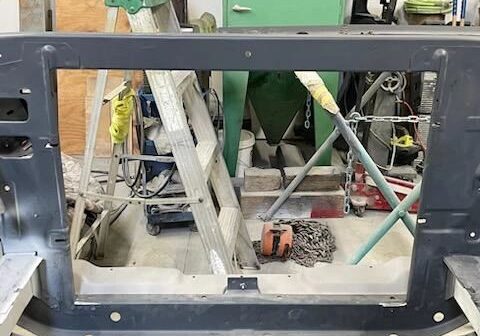 Workshop with ladders and tools in view.