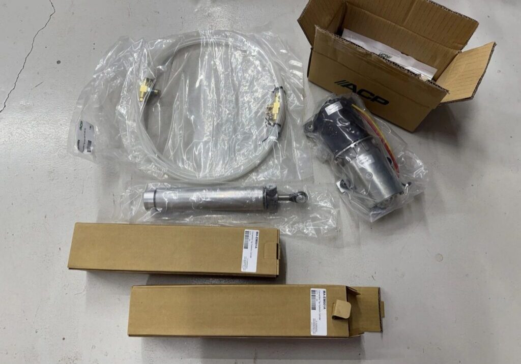 Car parts and cables with packaging boxes.